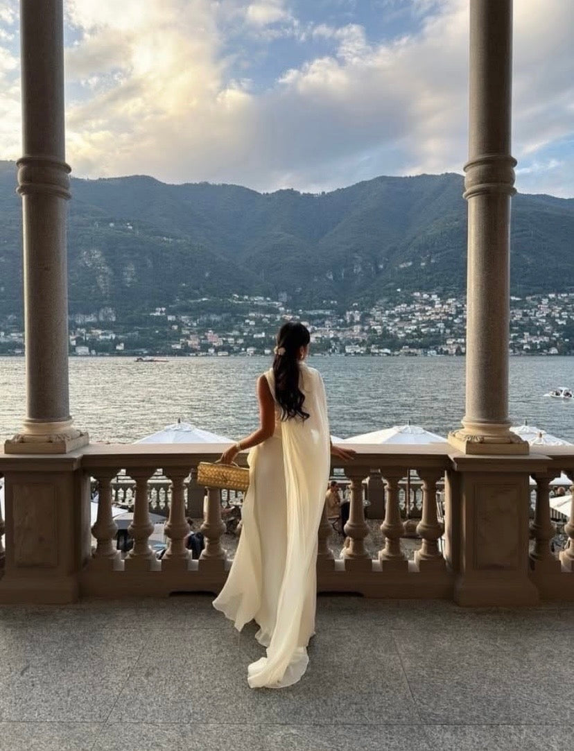 Draped High-Neck Sleeveless Gown with Flowing Cape Train